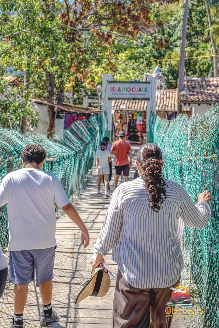 Crossing the Río Cuale suspension bridge